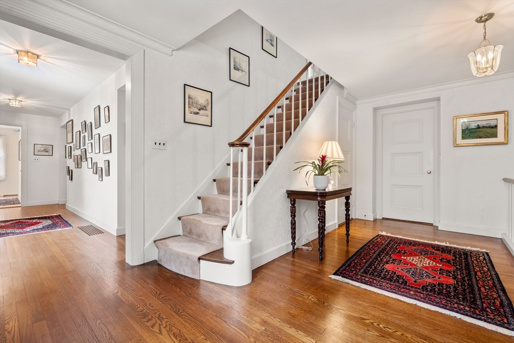 27 Laurel Road Chestnut Hill, MA 02467 - Photo 10 of 20 a view of entryway and hall with wooden floor