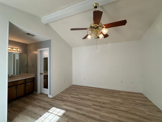 a view of a bathroom from the hallway