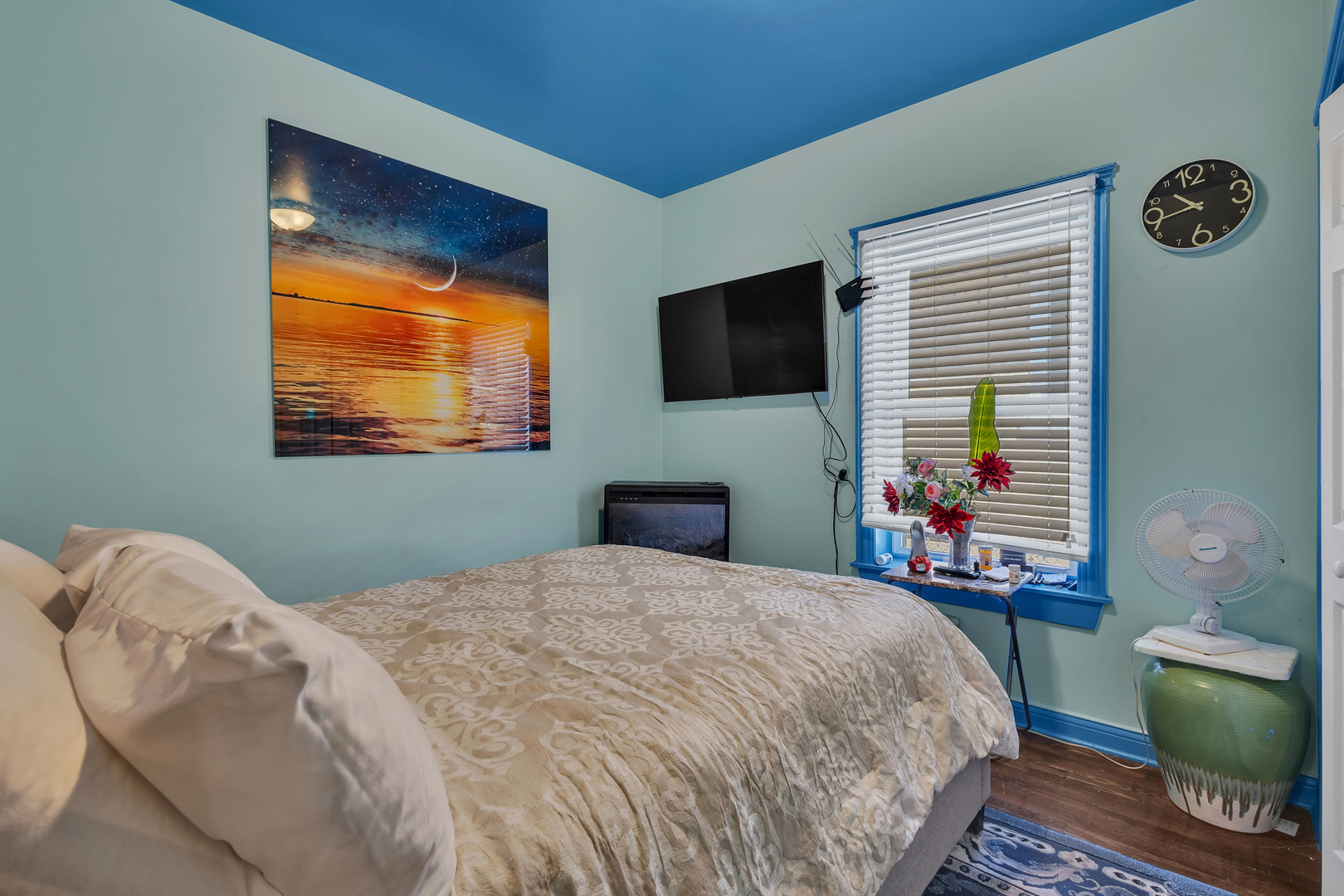 1418 North Mayfield Avenue Chicago, IL 60651 - Photo 14 of 28 a bedroom with a bed and a flat screen tv