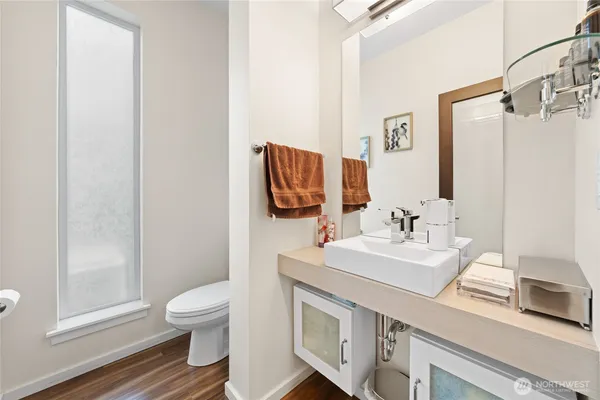 a bathroom with a sink toilet and shower