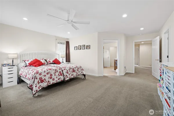 a bedroom with a bed and a cabinets