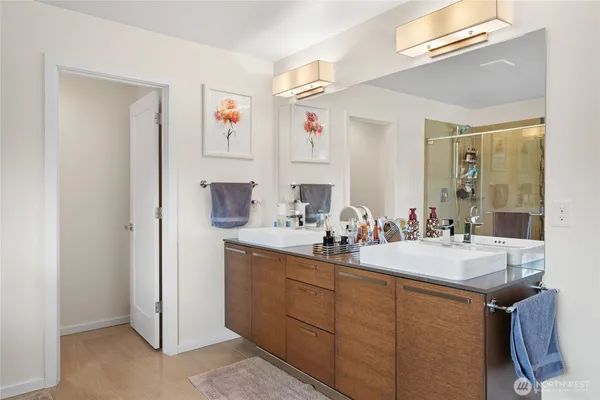 a bathroom with a sink vanity and a mirror