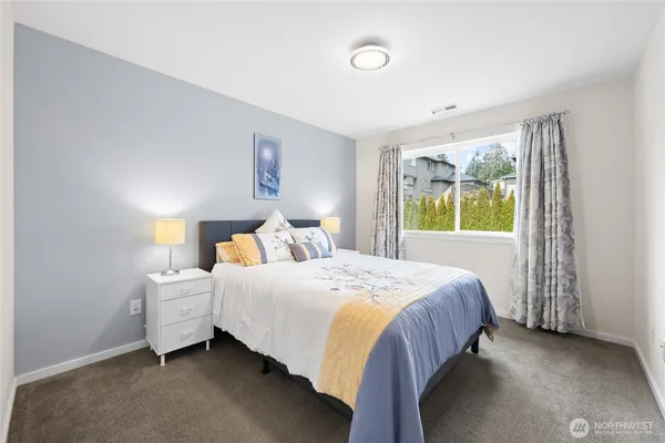 a bedroom with a bed and window