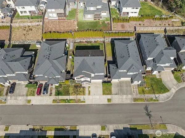an aerial view of residential houses with outdoor space