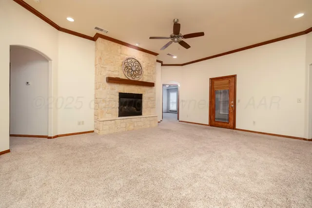 a view of a livingroom with a ceiling fan dryer and staircase