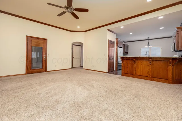 a view of a livingroom with a ceiling fan