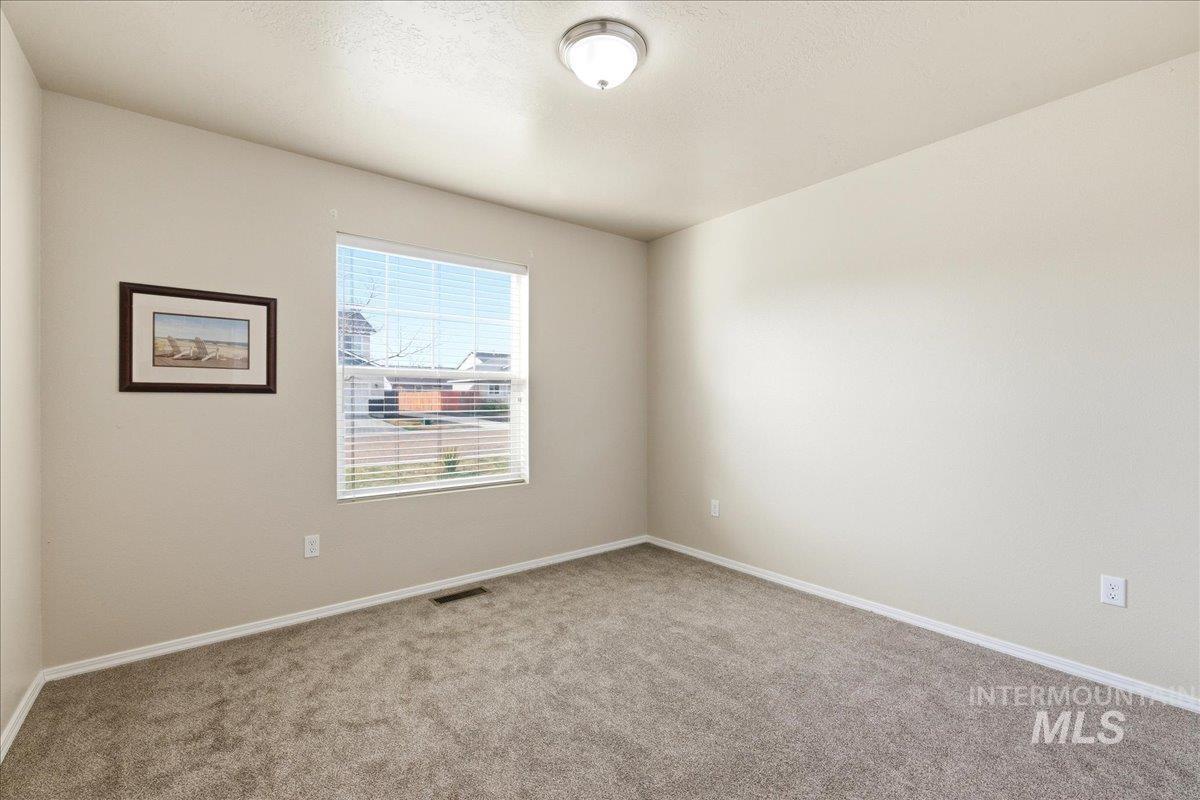 13622 Orlando Street Caldwell, ID 83607 - Photo 11 of 16 Carpeted empty room with baseboards