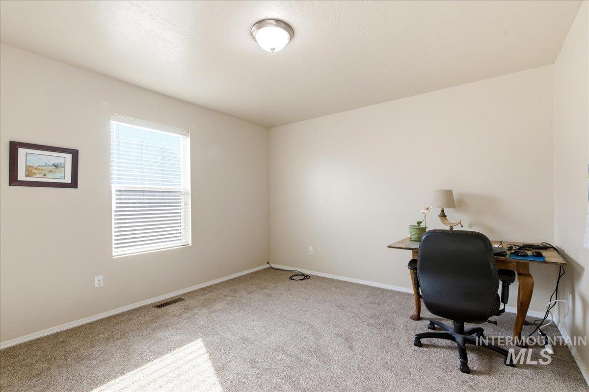13622 Orlando Street Caldwell, ID 83607 - Photo 12 of 16 Unfurnished office featuring light carpet and baseboards