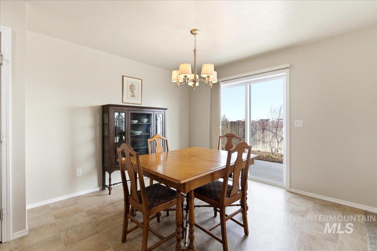 13622 Orlando Street Caldwell, ID 83607 - Photo 6 of 16 Dining space with baseboards and suspended lighting