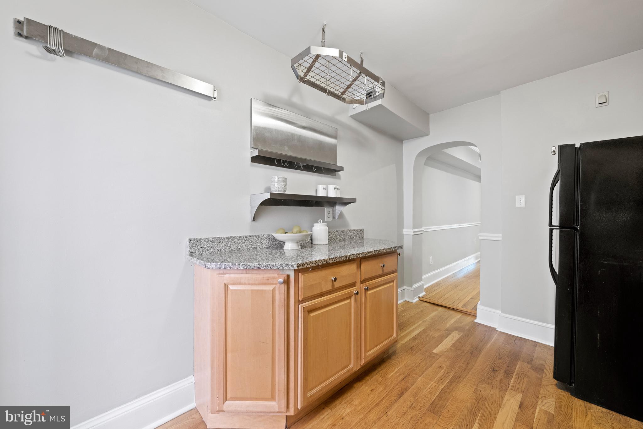 718 13th Street Northeast Washington, DC 20002 - Photo 13 of 35 a kitchen with stainless steel appliances granite countertop a sink and a refrigerator