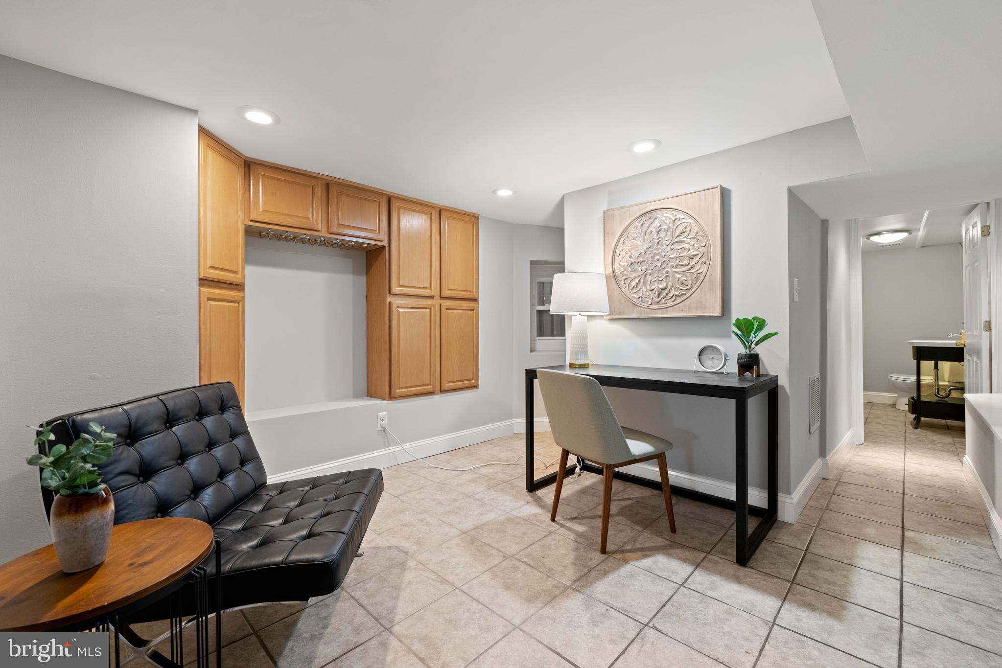 718 13th Street Northeast Washington, DC 20002 - Photo 14 of 35 a living room with furniture and a potted plant