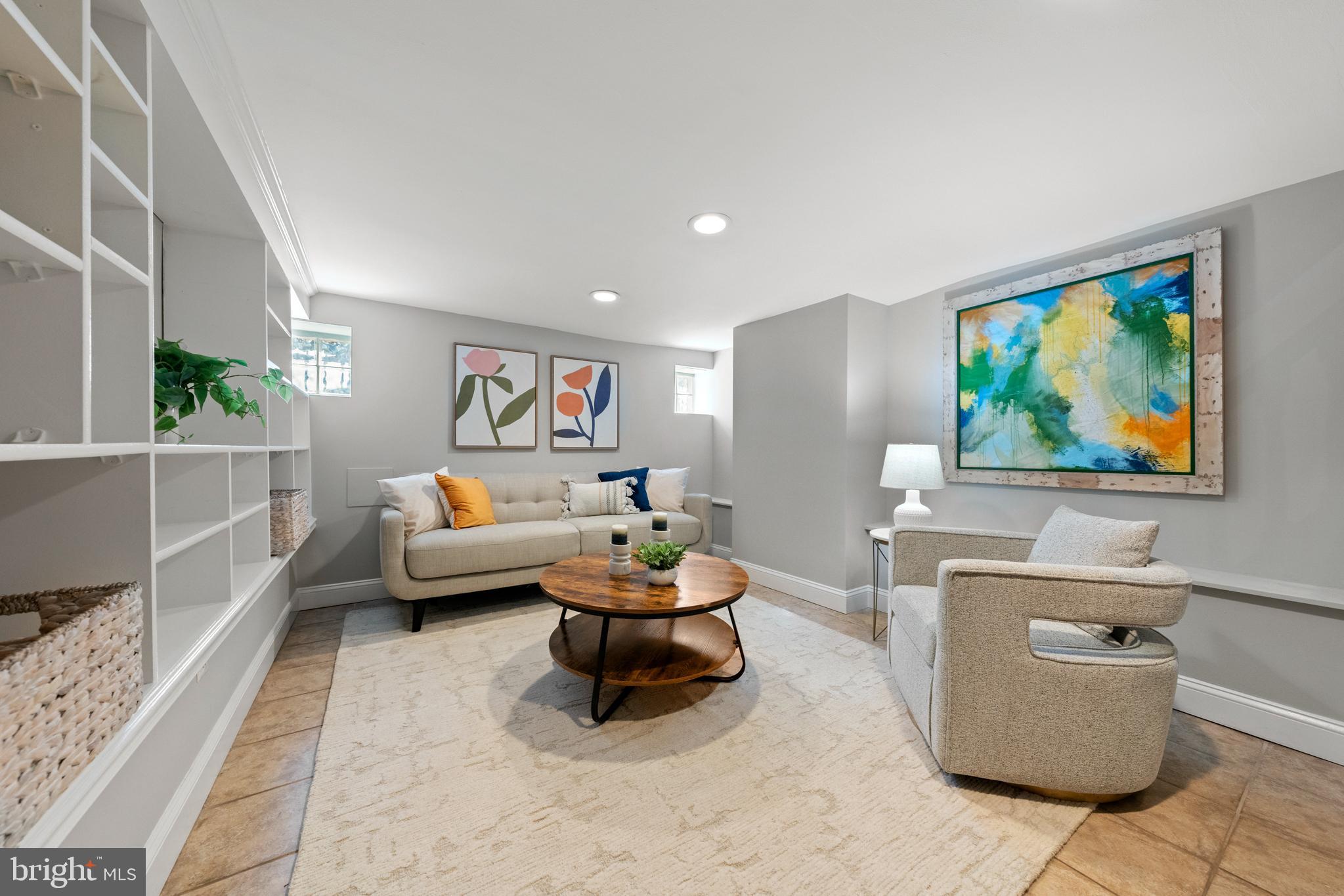 718 13th Street Northeast Washington, DC 20002 - Photo 15 of 35 a living room with furniture and a flat screen tv