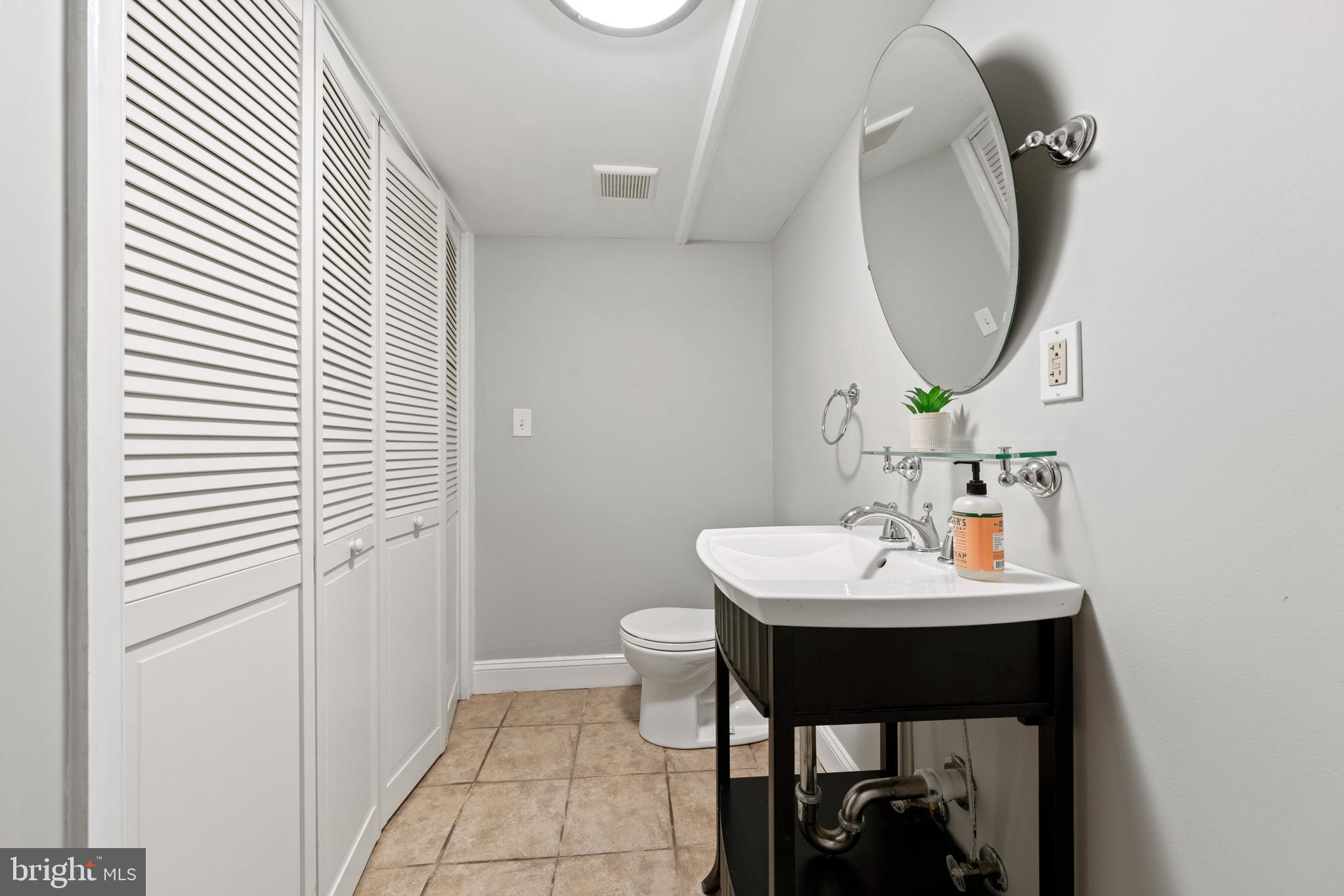 718 13th Street Northeast Washington, DC 20002 - Photo 19 of 35 a bathroom with a sink and a mirror