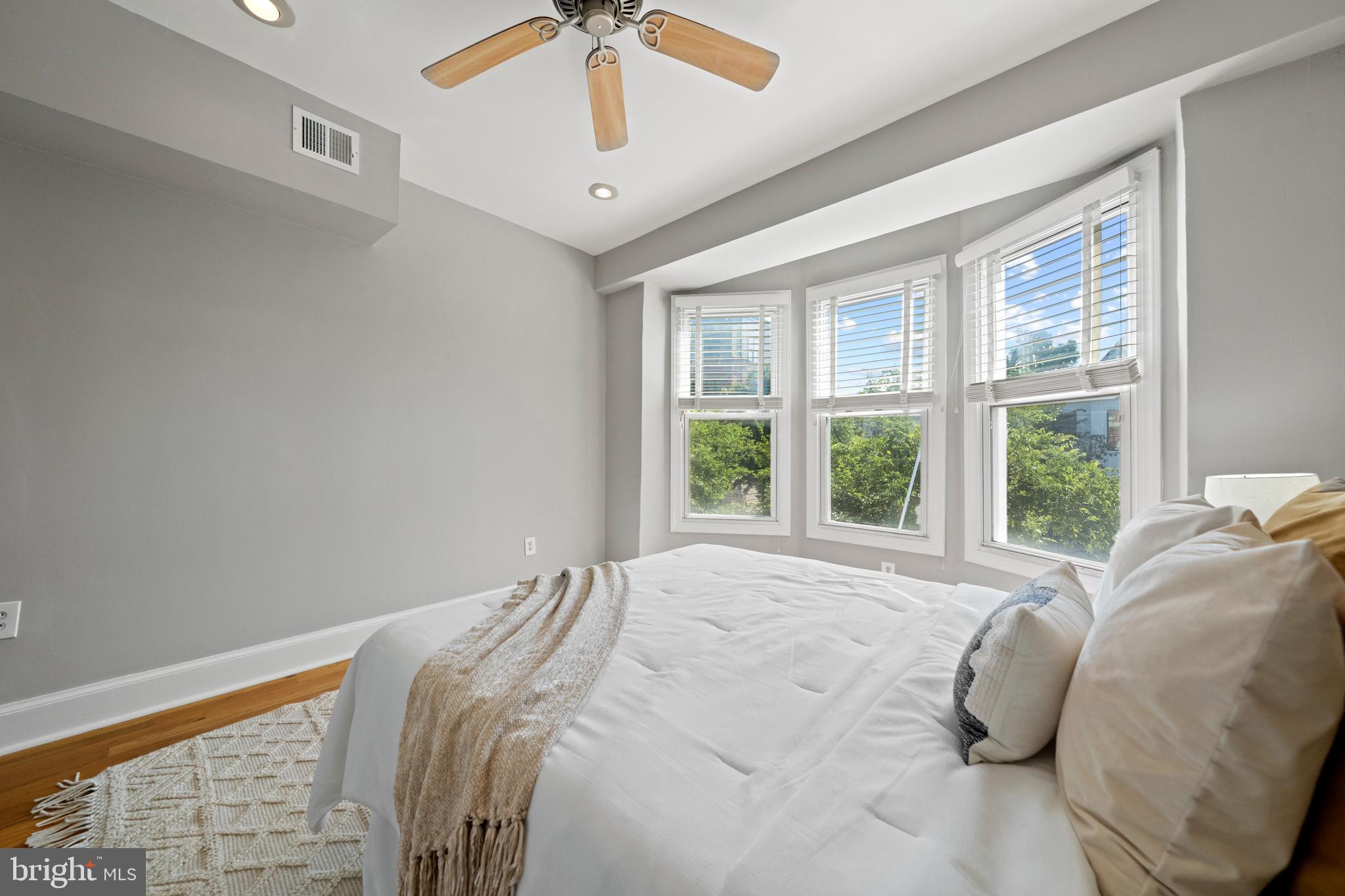 718 13th Street Northeast Washington, DC 20002 - Photo 21 of 35 a bed sitting in a bedroom next to a window
