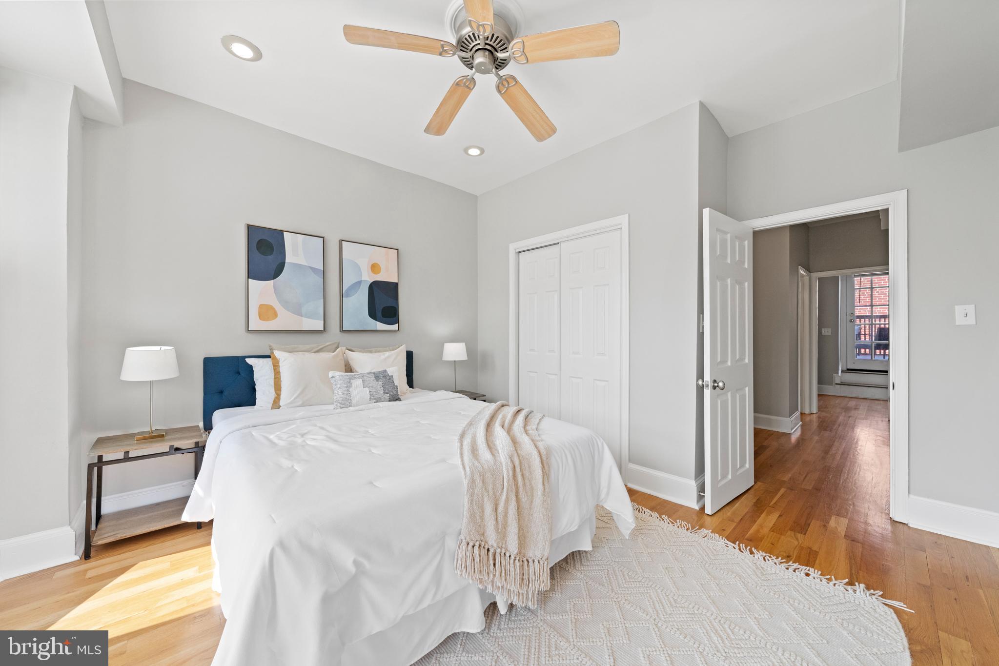718 13th Street Northeast Washington, DC 20002 - Photo 22 of 35 a bedroom with a bed and a chandelier