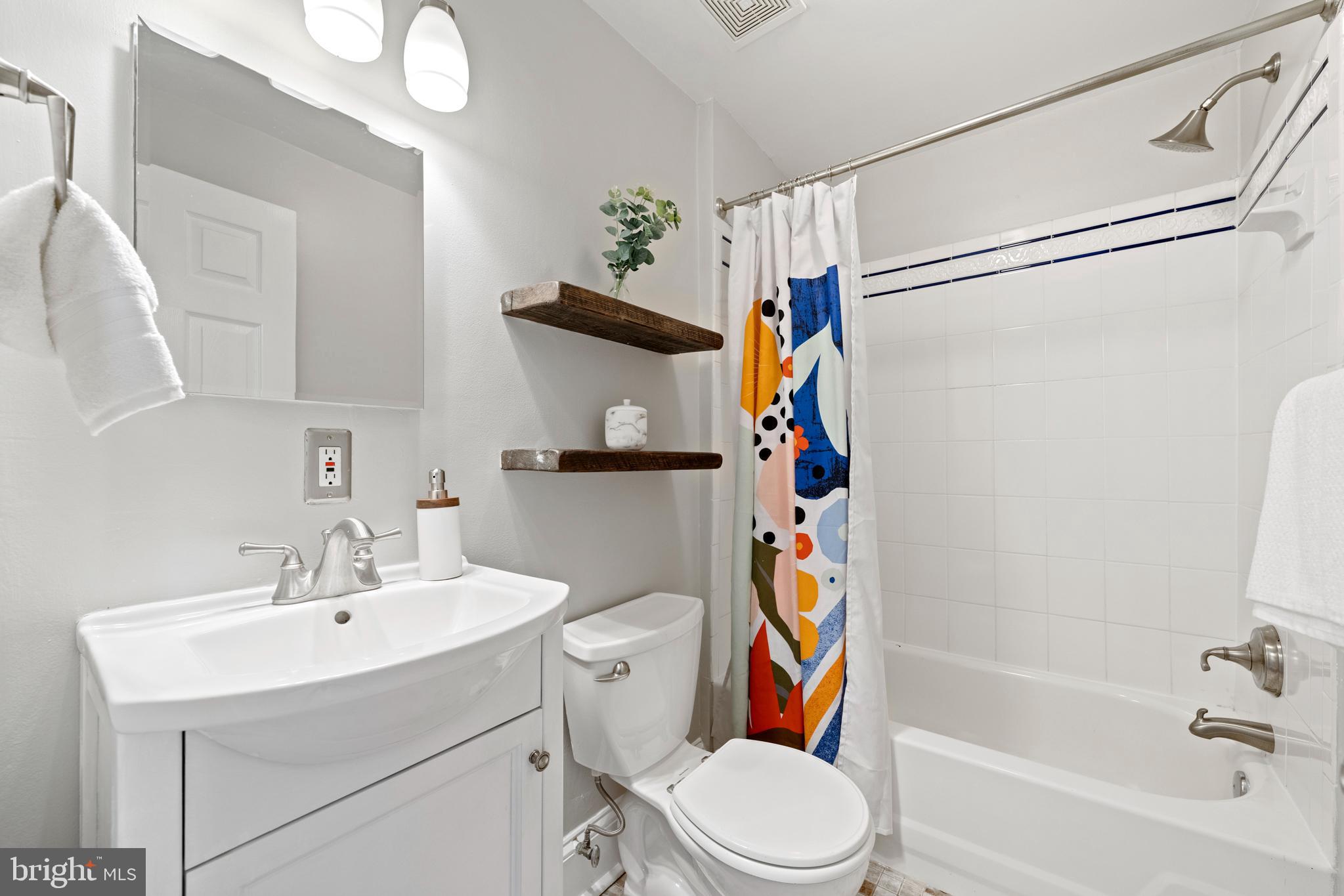 718 13th Street Northeast Washington, DC 20002 - Photo 23 of 35 a bathroom with a sink toilet and shower