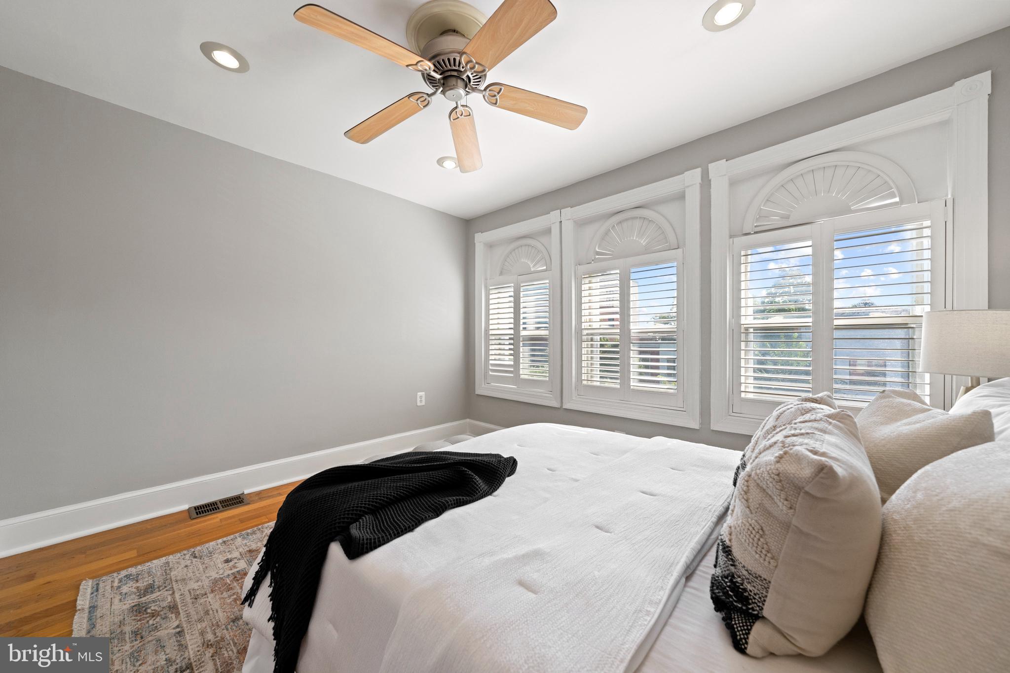 718 13th Street Northeast Washington, DC 20002 - Photo 25 of 35 a bedroom with a large bed chandelier and a window
