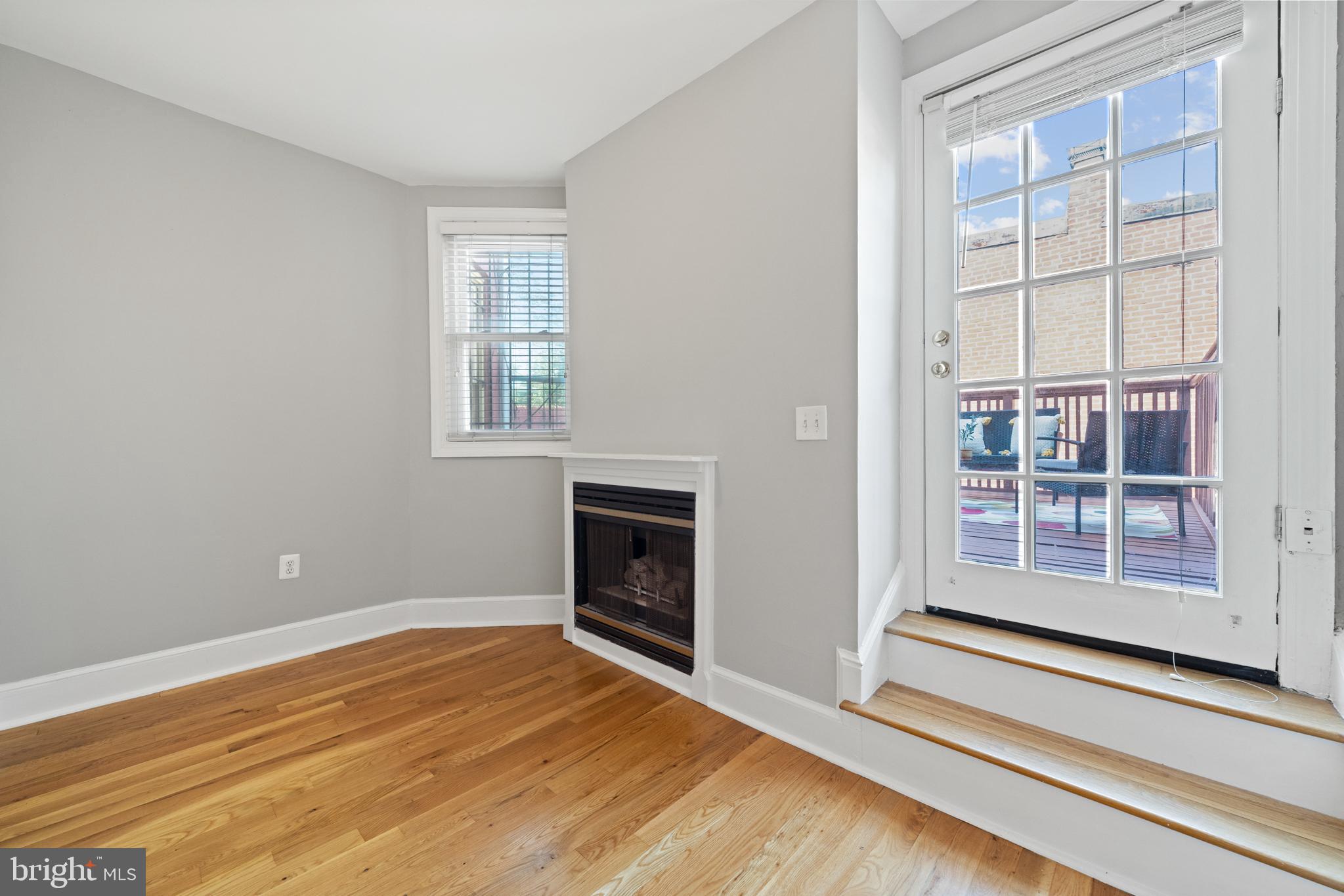 718 13th Street Northeast Washington, DC 20002 - Photo 27 of 35 a view of an empty room with wooden floor and a window
