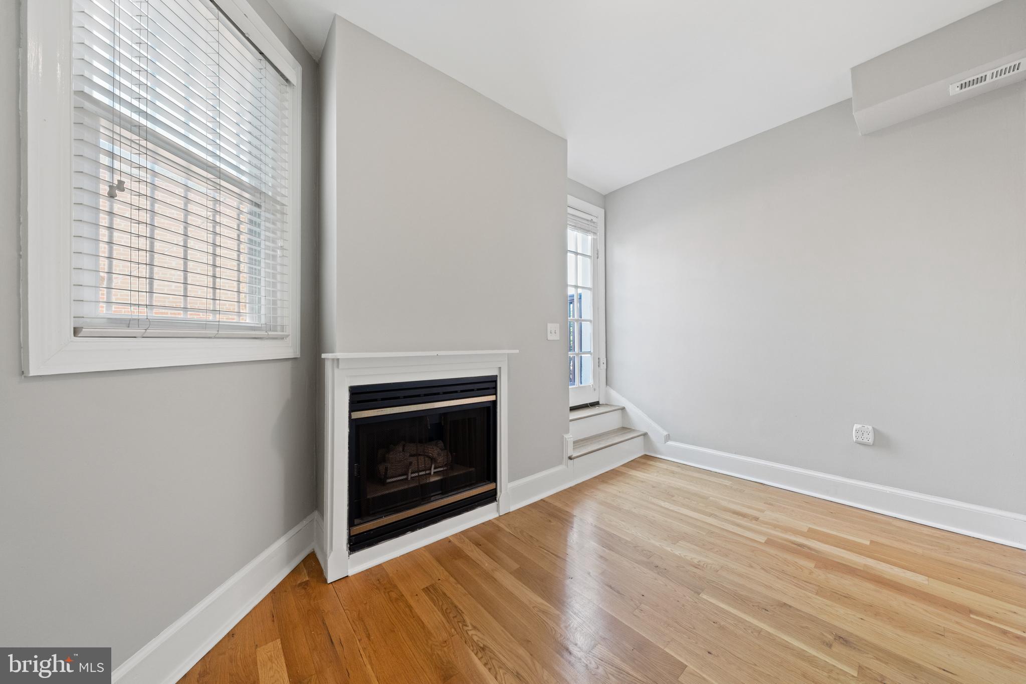 718 13th Street Northeast Washington, DC 20002 - Photo 28 of 35 a view of empty room with wooden floor and fireplace