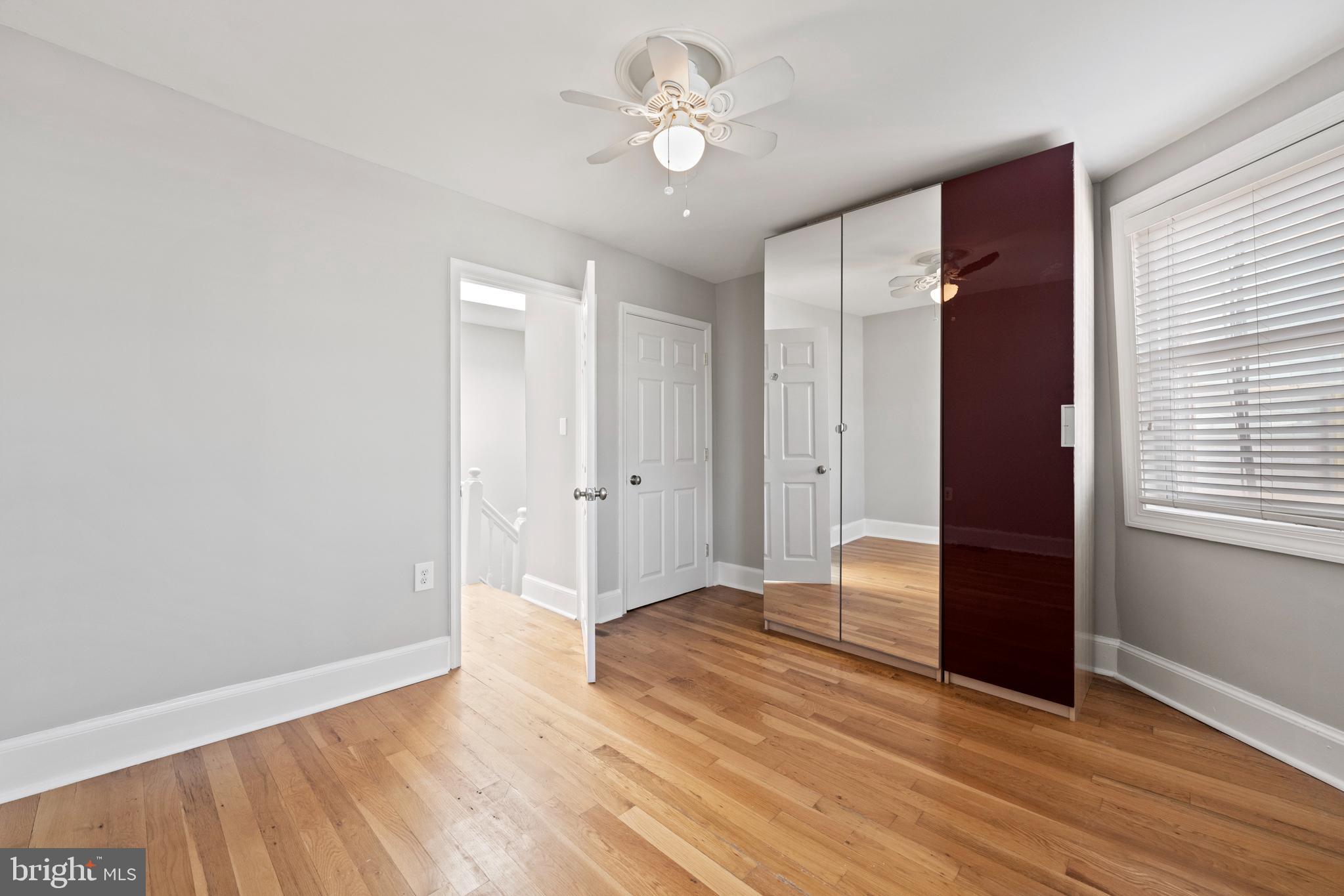 718 13th Street Northeast Washington, DC 20002 - Photo 29 of 35 wooden floor in an empty room with a window