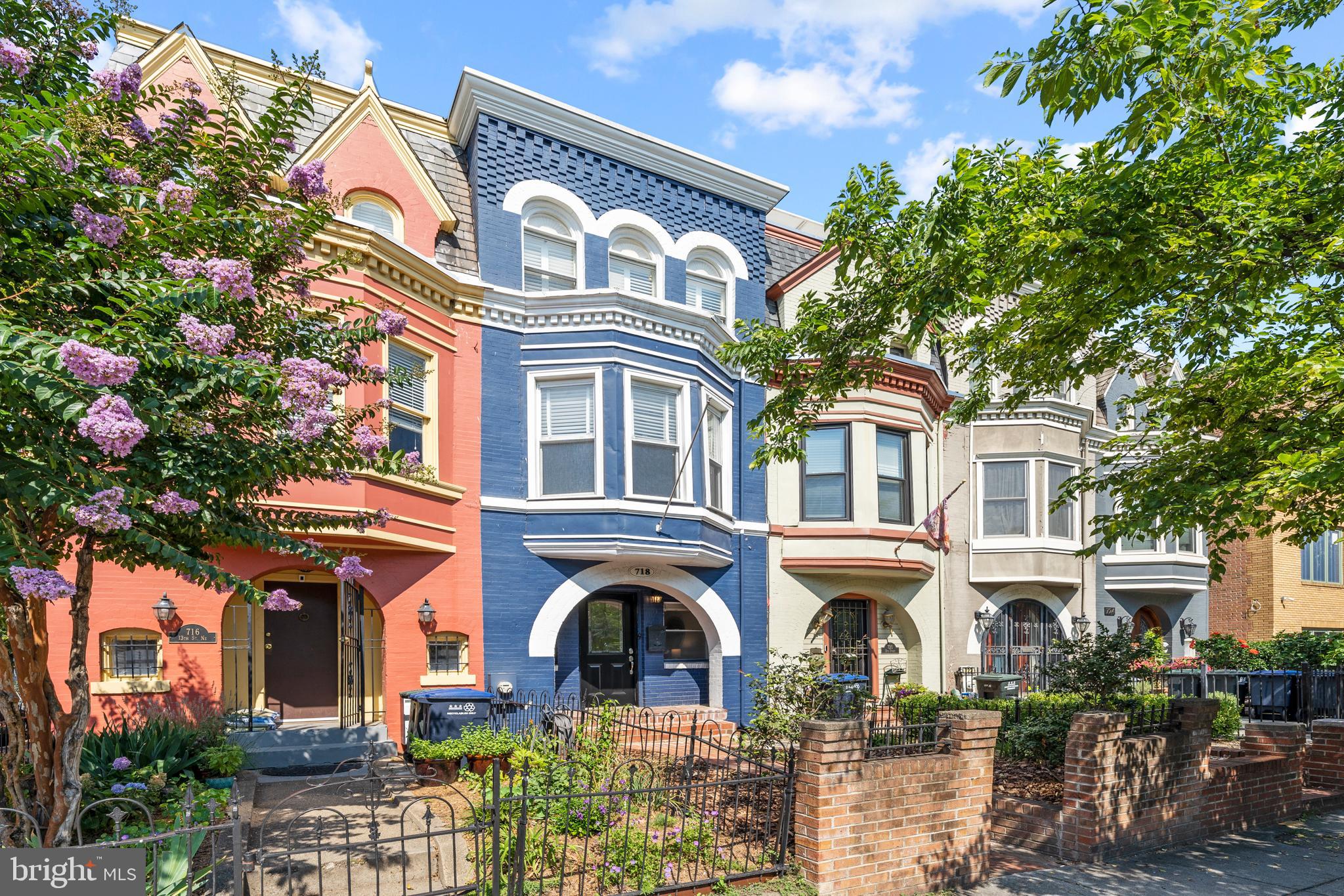 718 13th Street Northeast Washington, DC 20002 - Photo 3 of 35 a front view of a residential apartment building with a yard