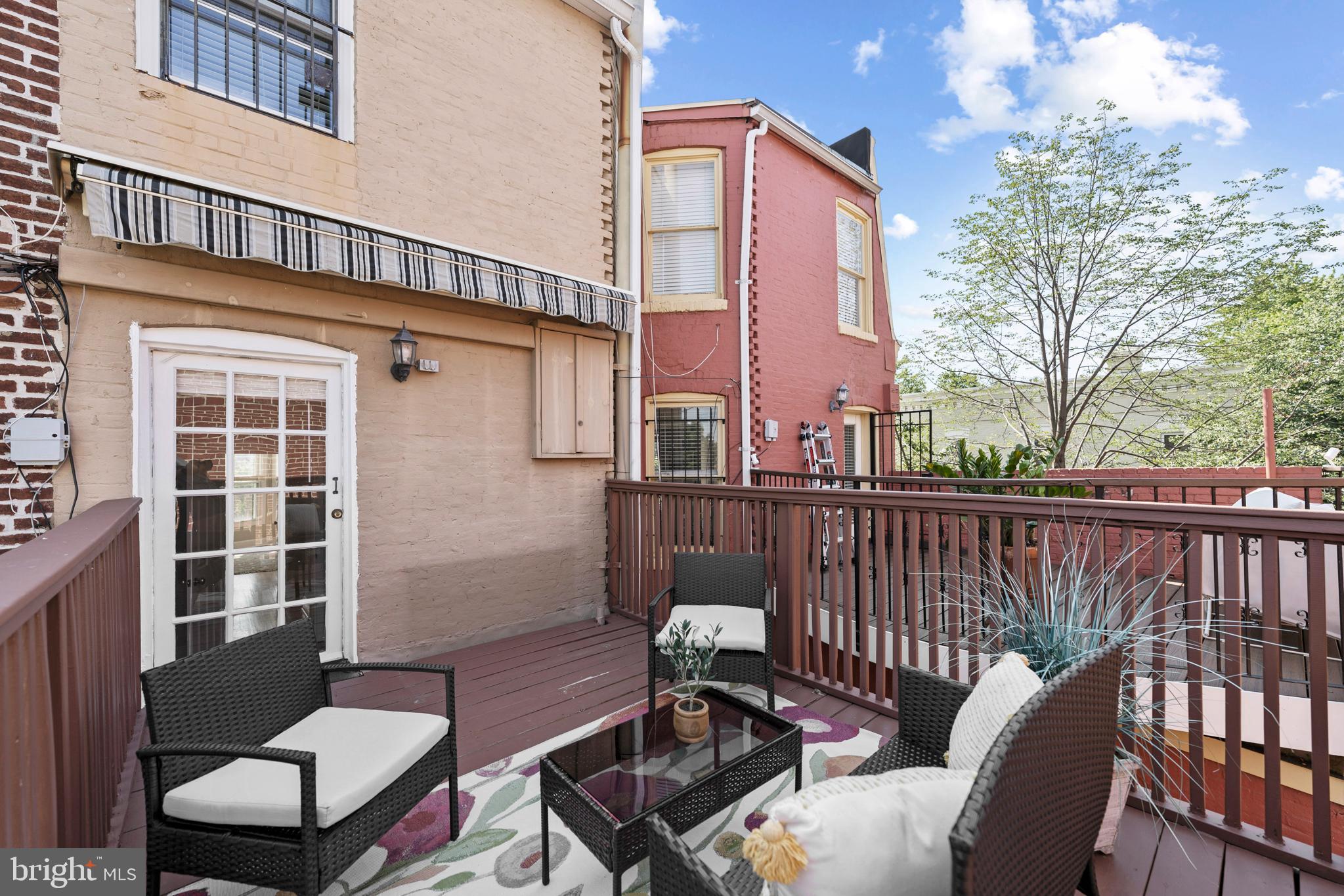 718 13th Street Northeast Washington, DC 20002 - Photo 32 of 35 a view of a chair and table in the balcony