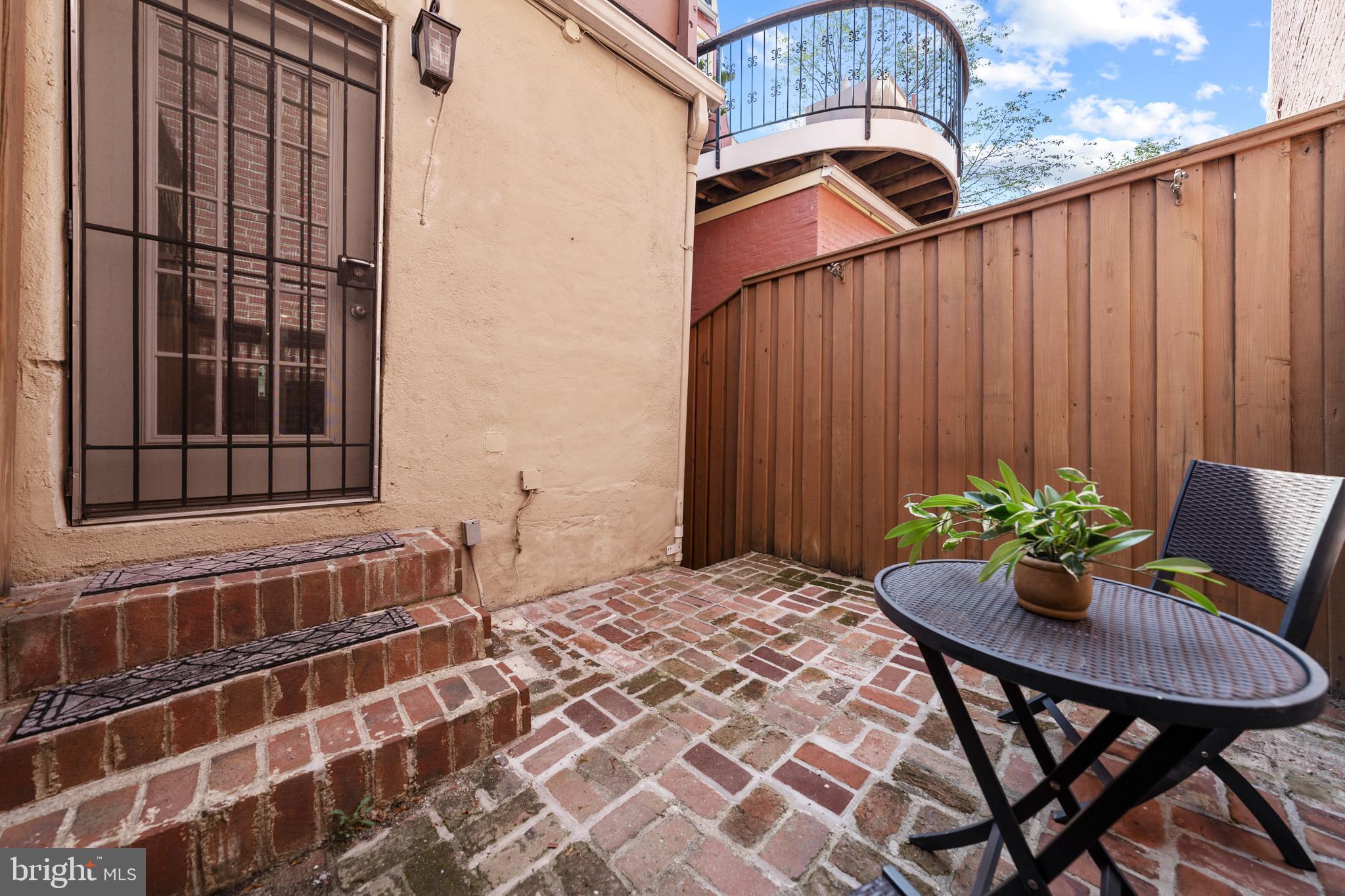 718 13th Street Northeast Washington, DC 20002 - Photo 35 of 35 a backyard of a house with table and chairs