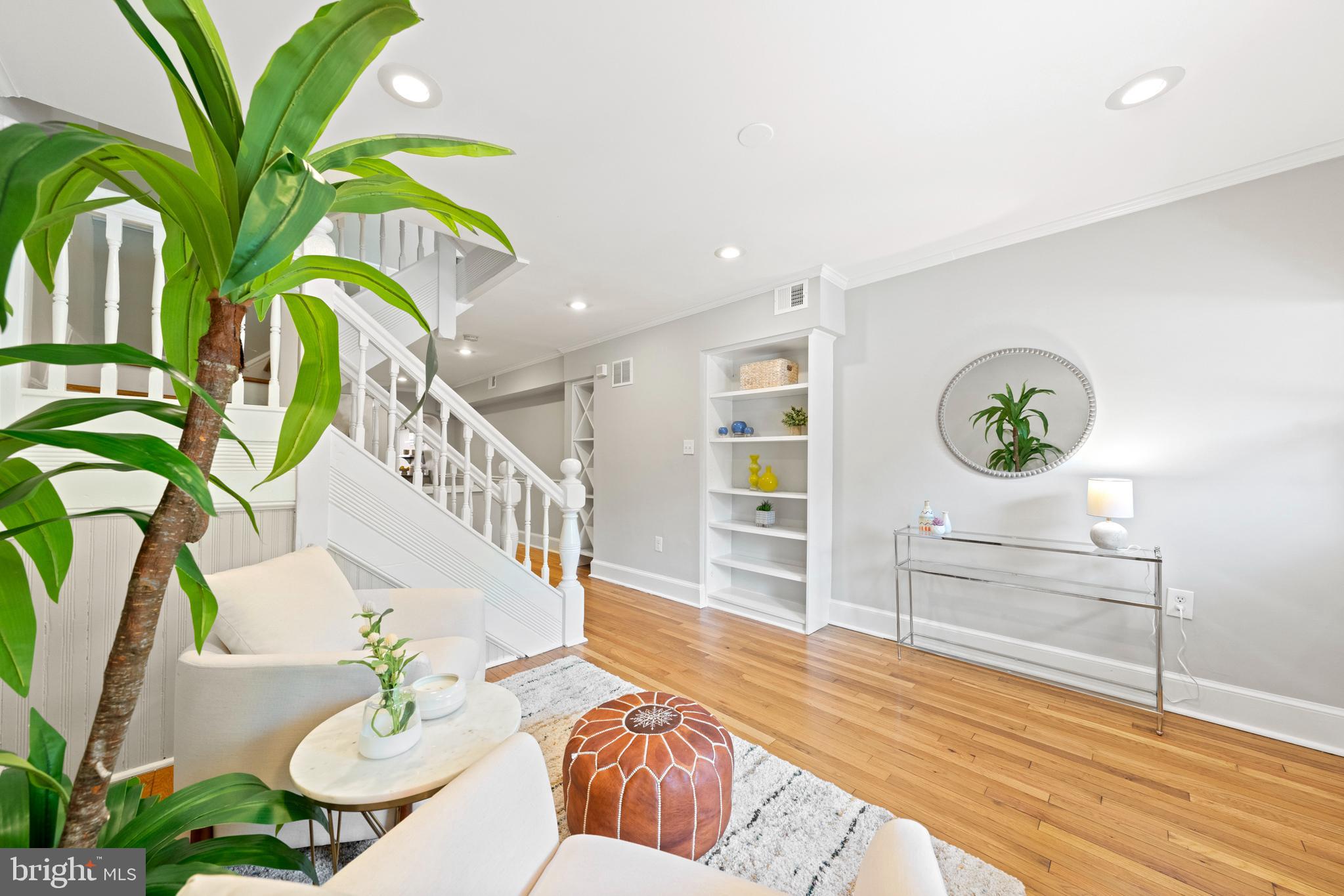 718 13th Street Northeast Washington, DC 20002 - Photo 9 of 35 a living room with furniture and a potted plant