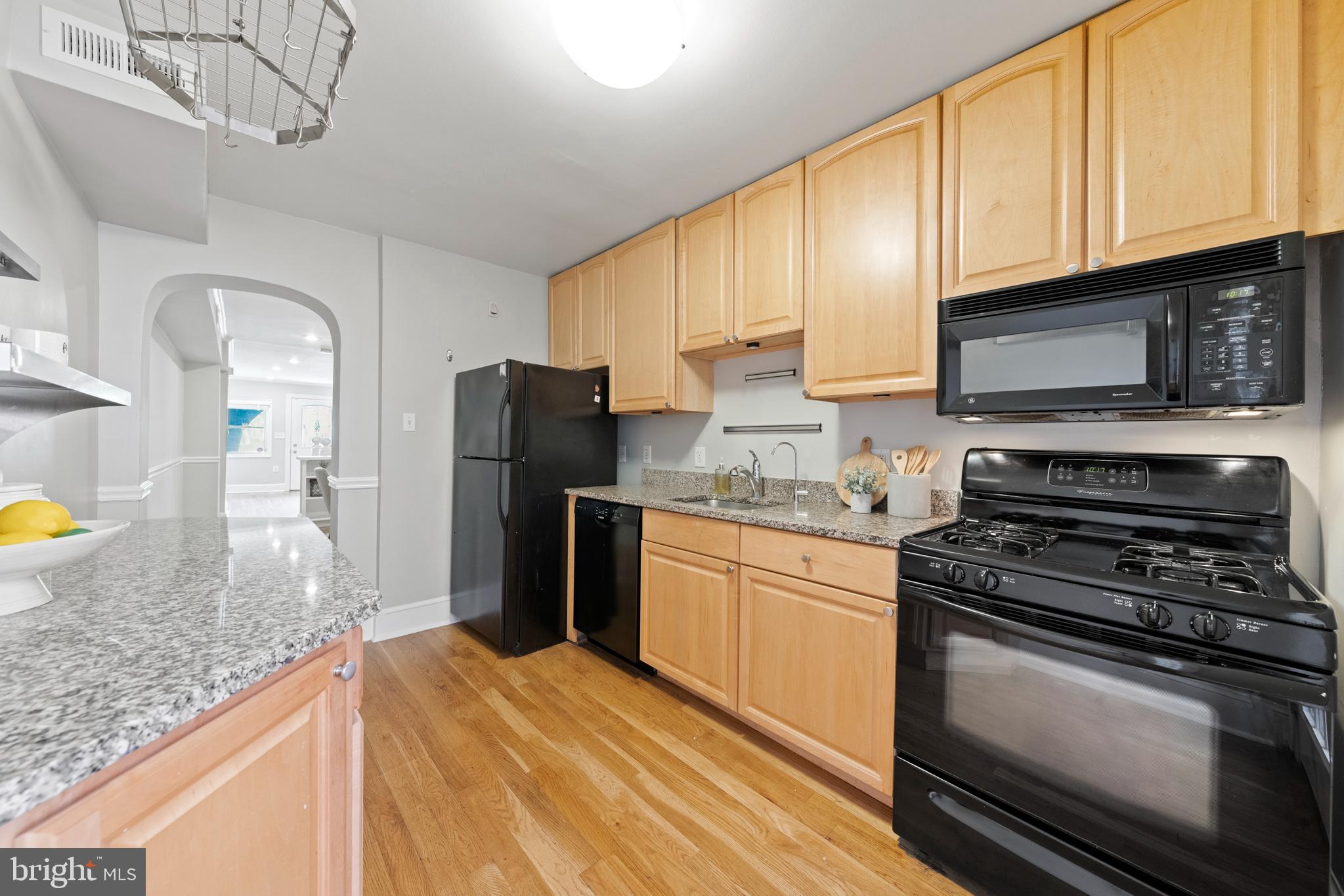 718 13th Street Northeast Washington, DC 20002 - Photo 10 of 35 a kitchen with stainless steel appliances granite countertop a stove a refrigerator and a sink