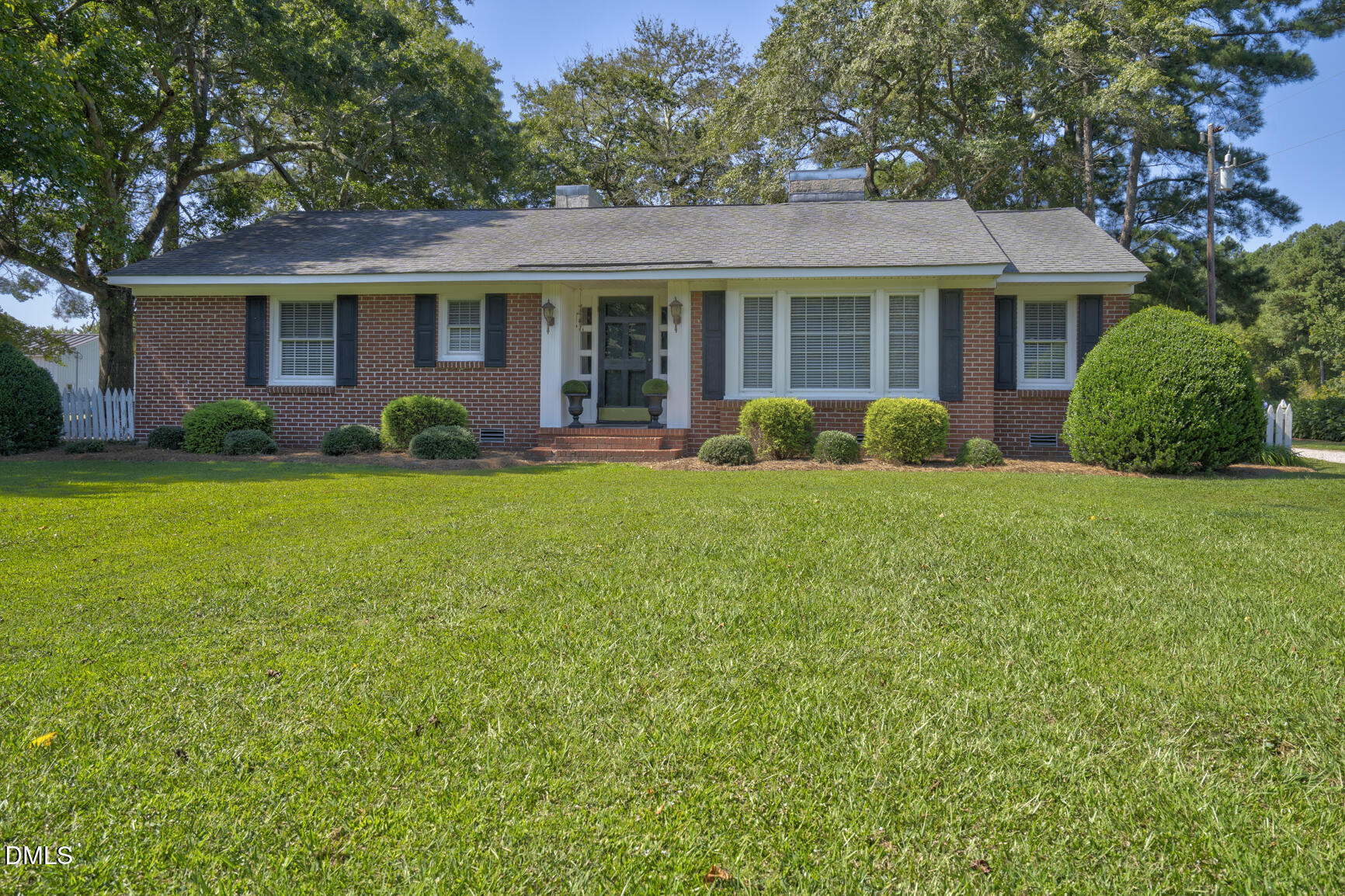 6515 Tonya Road Elm City, NC 27822 - Photo 3 of 52 a front view of a house with a yard and garage