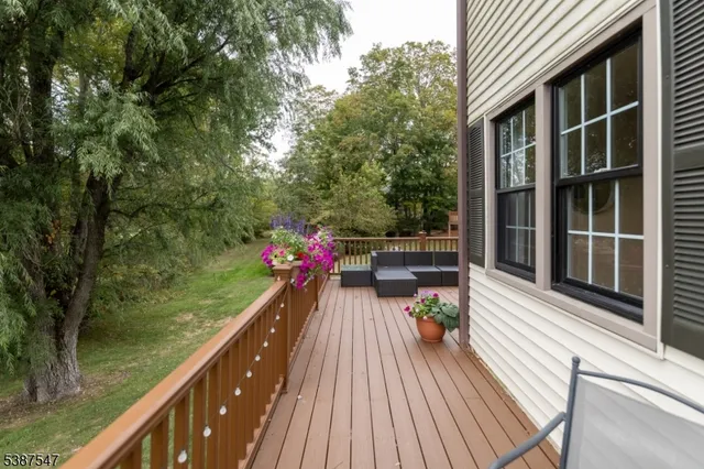 a view of a balcony with two chairs and a table