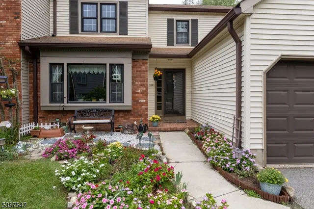a front view of house with an outdoor seating