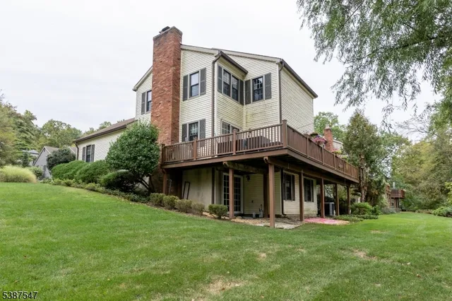a view of a house with a yard and plants
