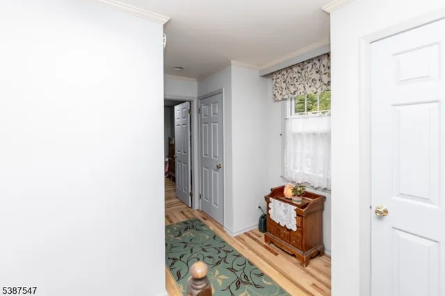 a bathroom with a toilet sink and shower curtain