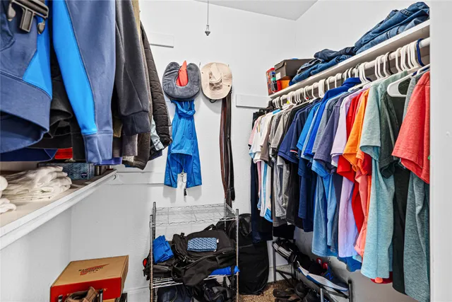 a bedroom with furniture and a window