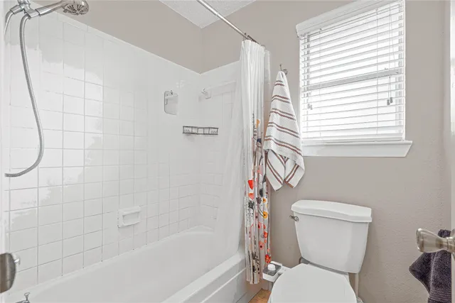 a view of a patio with a table chairs and backyard