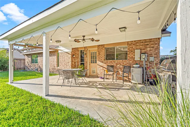 a view of a house with a yard and a garden
