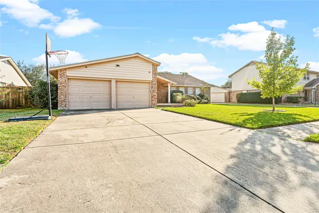 a room with wooden floor and furniture