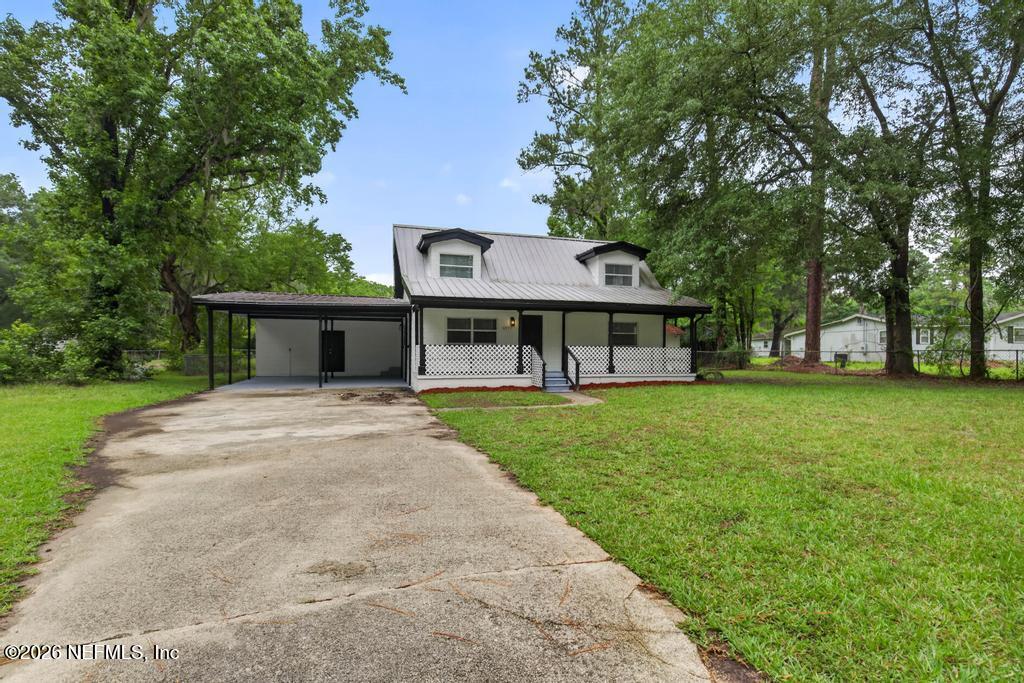 front view of a house with a yard
