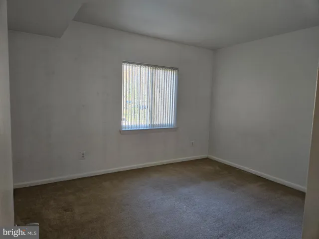 a bathroom with a toilet sink and shower