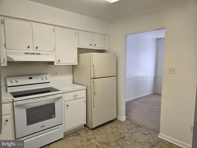 a utility room with sink dryer and washer