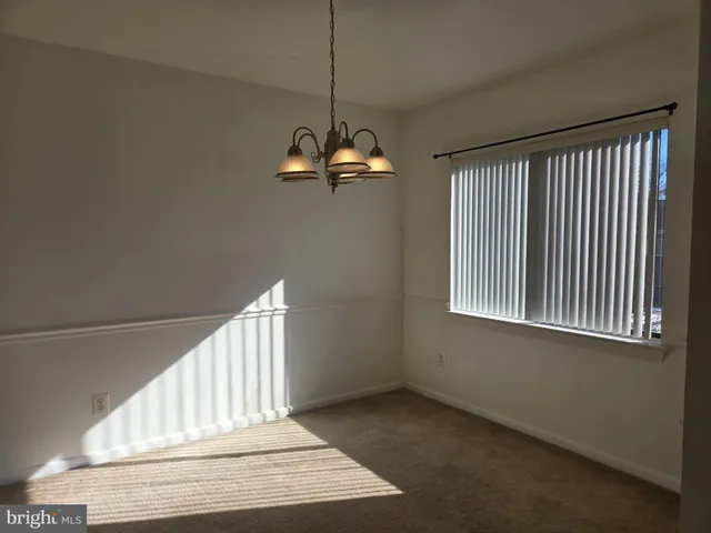 an empty room with closet area