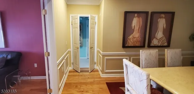 a bedroom with a bed dresser and a window