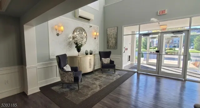 a room with pool table and windows