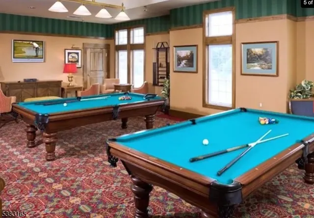 a swimming pool view with a outdoor seating space