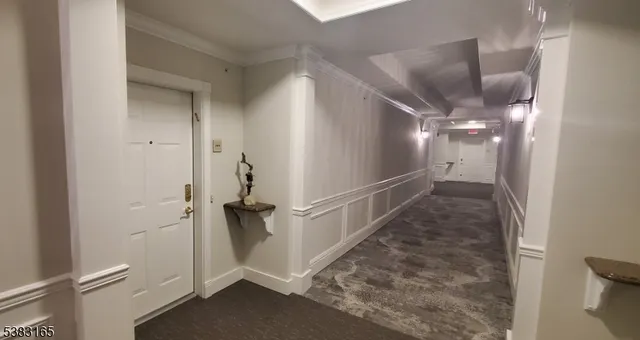 a view of a hallway with a white walls