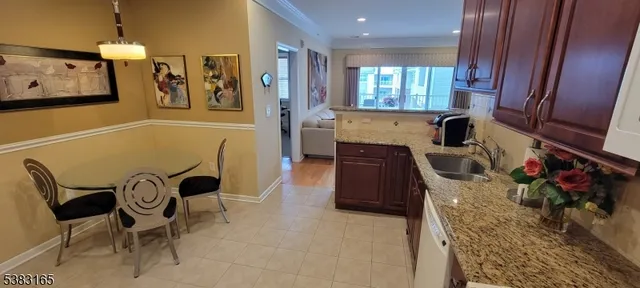 a view of a kitchen with furniture and a window