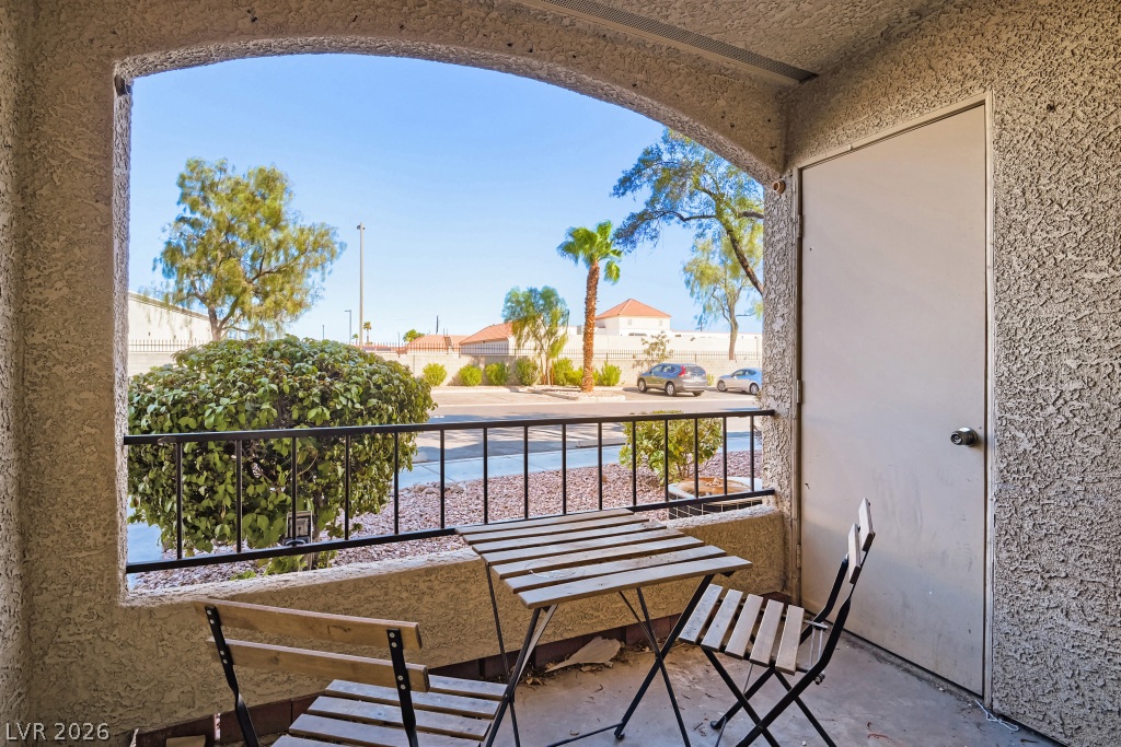7885 West Flamingo Road, Unit 1003 Las Vegas, NV 89147 - Photo 4 of 22 An arched opening frames peaceful neighborhood views from this private concrete patio.