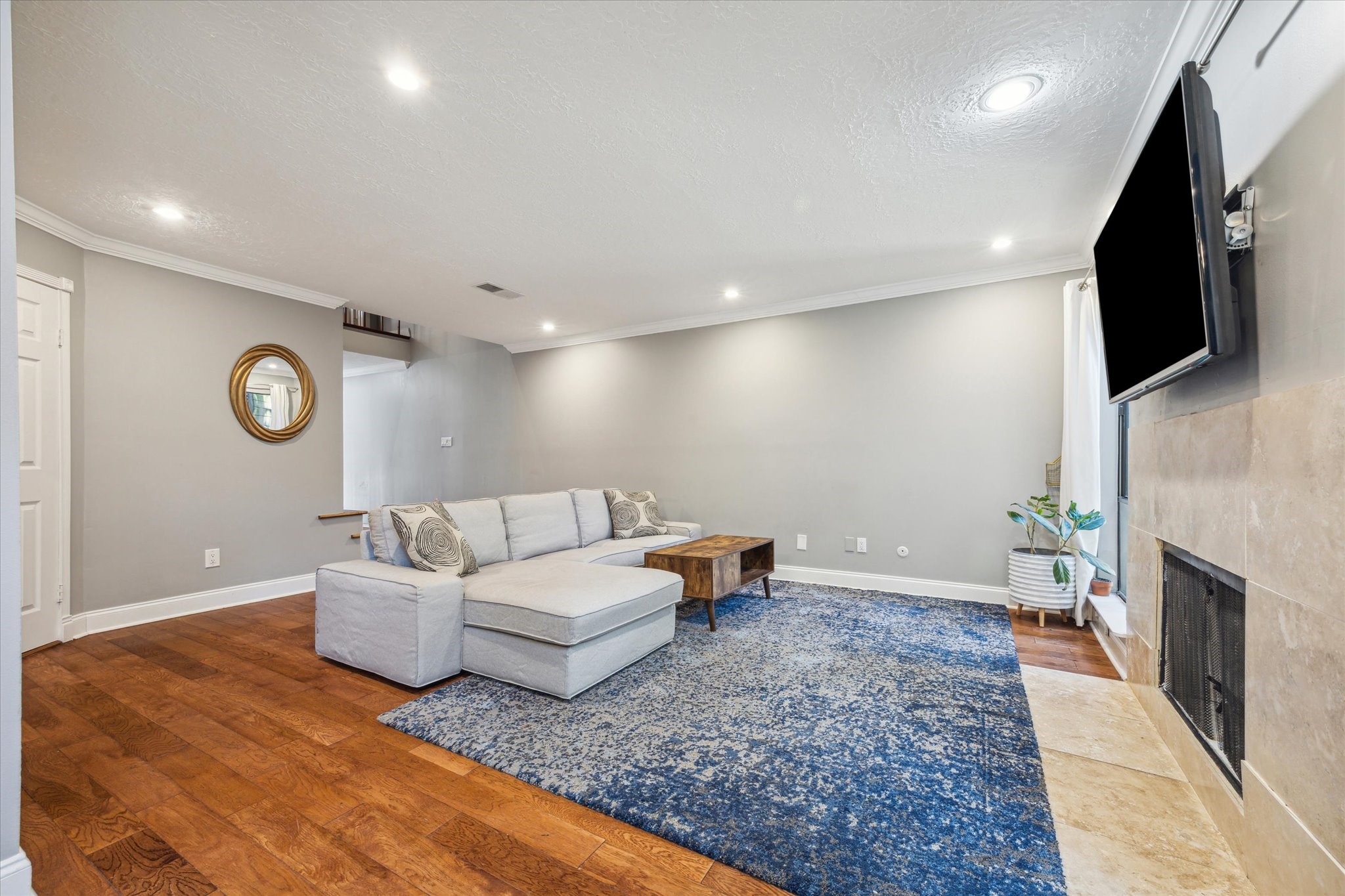 2107 Morgan Street Houston, TX 77006 - Photo 4 of 13 Spacious living area w/ recessed lighting designed for both relaxing nights in and effortless entertaining.