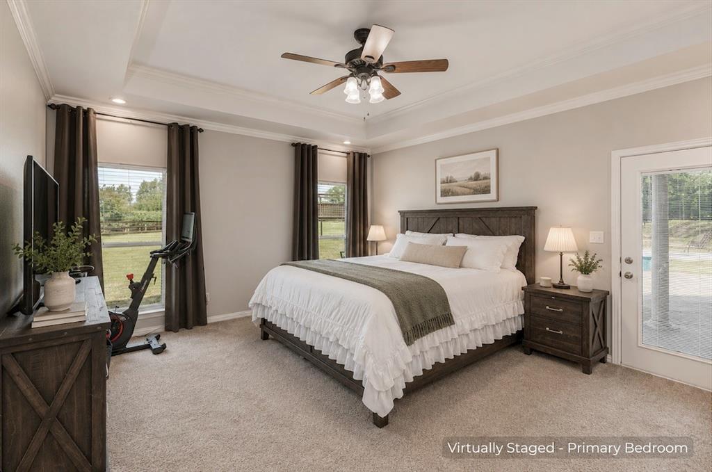 15 Trail Ridge Drive Melissa, TX 75454 - Photo 18 of 38 a spacious bedroom with a bed and a chandelier
